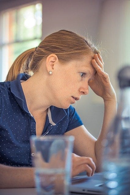 Stressed woman in a workplace setting