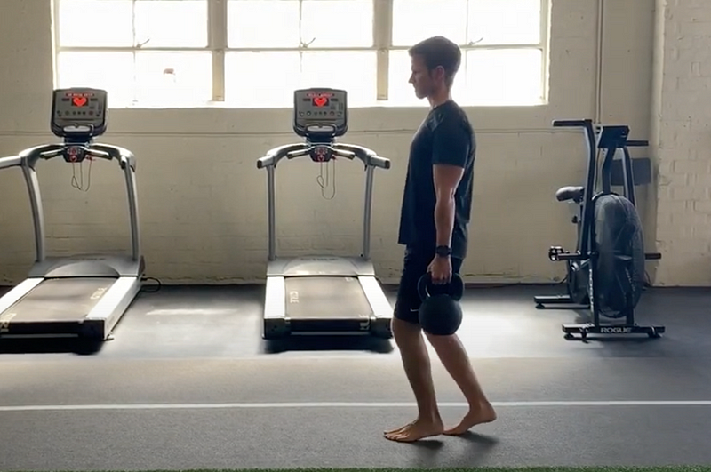 Performing loaded creeper walks for calf strength