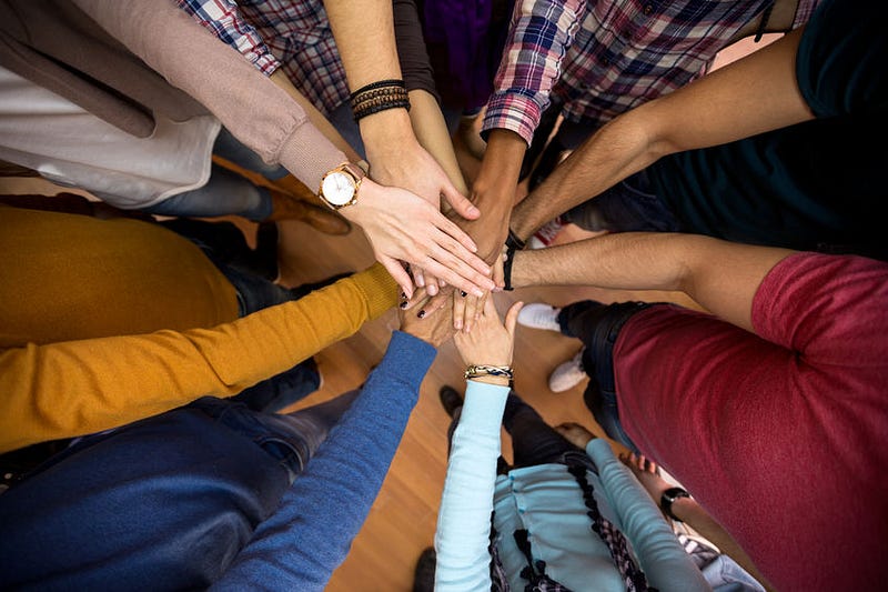 Diverse group of scientists collaborating in a lab